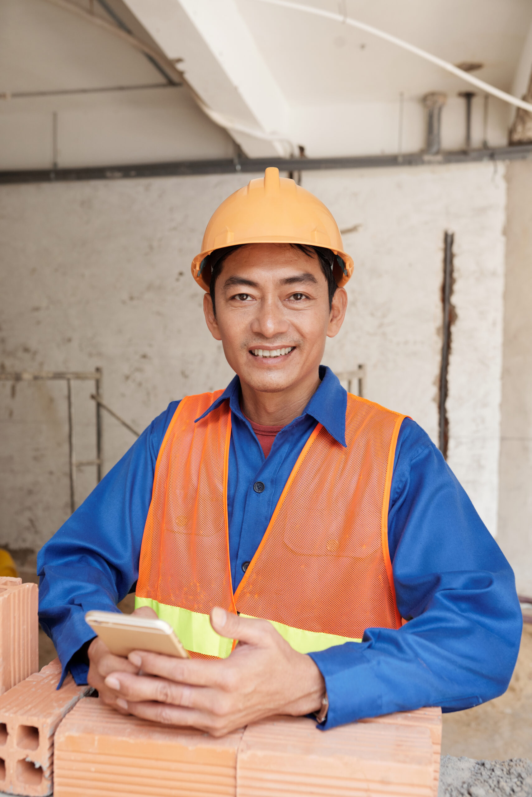 Texting construction worker